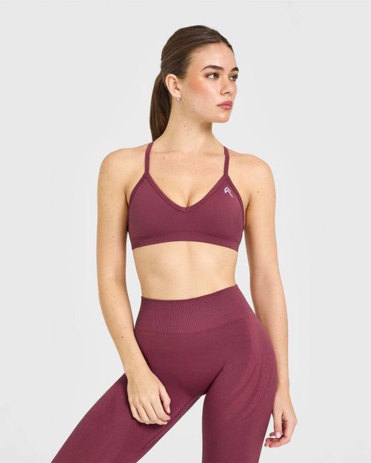 EnhanceLift™ Seamless Strappy Sports Bra with White Logo - Burnt Maroon